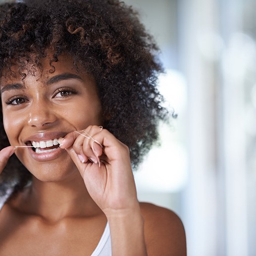 Picture of someone flossing