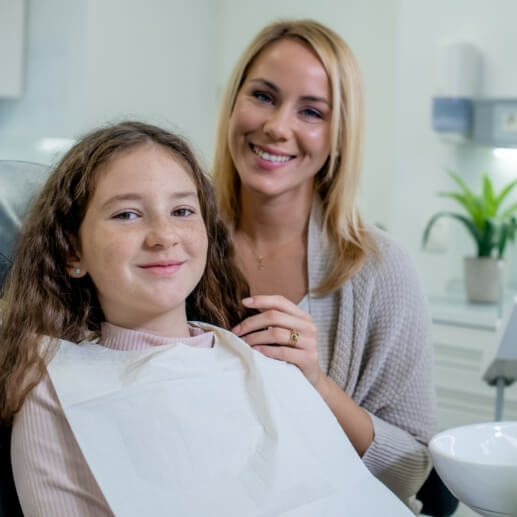 Teenage girl smiling at dental appointment