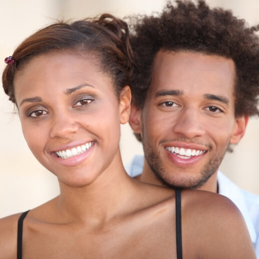 Young man and woman smiling together