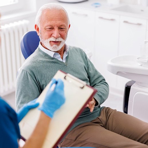 a patient consulting with their dentist