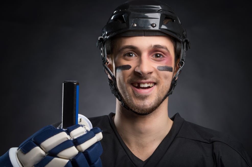 A hockey player missing a tooth